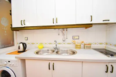 Una cocina o zona de cocina en Expoholidays Vistas al mar - A pie de playa