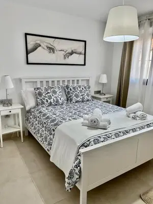 Cama o camas de una habitación en Apartamento Turístico Julia Gemella Acci