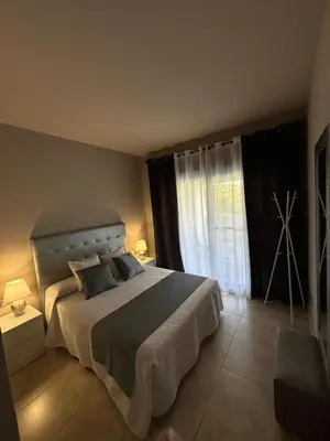 Cama o camas de una habitación en Apartamento Al-Alba Golf Resort Valle del Este Vera