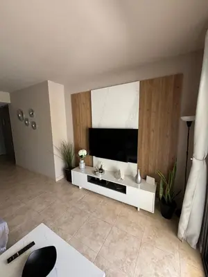 Una televisión o centro de entretenimiento en Apartamento Al-Alba Golf Resort Valle del Este Vera