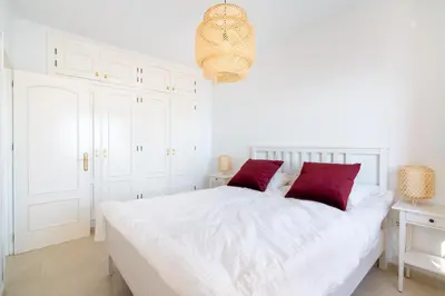 Cama o camas de una habitación en Chalet con vistas al mar y piscina
