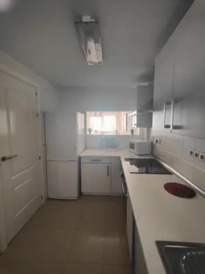 Una cocina o zona de cocina en Apartamento Playa del Faro