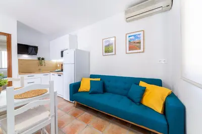 Una televisión o centro de entretenimiento en Apartamentos Lizamar San José Cabo de Gata