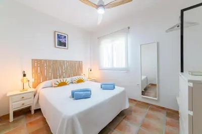 Cama o camas de una habitación en Apartamentos Lizamar San José Cabo de Gata