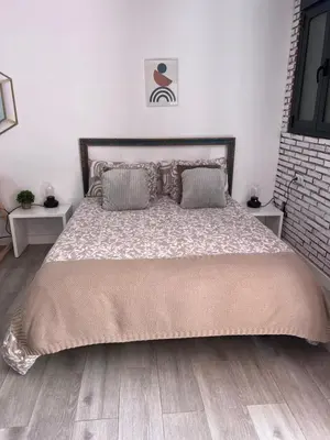 Cama o camas de una habitación en Coqueto loft en la playa