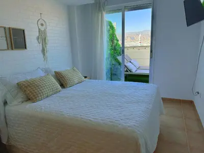 Cama o camas de una habitación en Ático junto al Auditorio con Terraza Privada y Parking