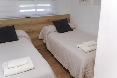 Cama o camas de una habitación en Ático junto al Auditorio con Terraza Privada y Parking