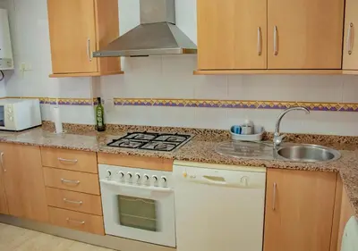 Una cocina o zona de cocina en Apto Julia 1ª Línea De Playa