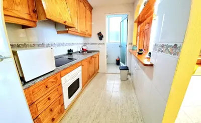 Una cocina o zona de cocina en Apartamento 1 dormitorio VERAMAR 1 2ª línea de playa
