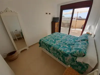 Cama o camas de una habitación en Apartamento en Águilas con amplia terraza y piscina