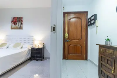 Cama o camas de una habitación en Precioso apartamento en el corazón de la ciudad-Wifi-Aire Acondicionado