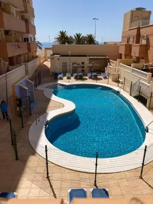 Piscina en o cerca de ATICO EN PRIMERA LINEA DE PLAYA