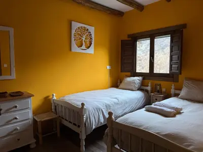Cama o camas de una habitación en CASA RURAL CORTIJO MOLINO ALTERO