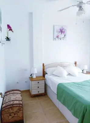 Cama o camas de una habitación en Casa familiar a pie de piscina