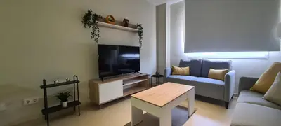 Una televisión o centro de entretenimiento en Apartamento Arena y Sal - Garrucha