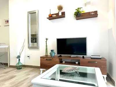 Una televisión o centro de entretenimiento en Apartamento Acacias