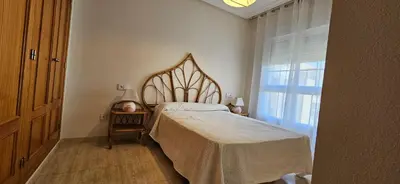 Cama o camas de una habitación en Apartamento primera linea de Playa Climatizado Internet