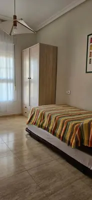 Cama o camas de una habitación en Apartamento primera linea de Playa Climatizado Internet