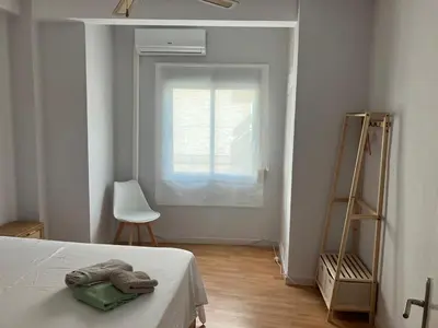 Cama o camas de una habitación en Tu Playa y tu Casa con terraza