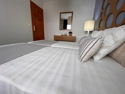 Cama o camas de una habitación en Casa de Violeta en Vera Coast