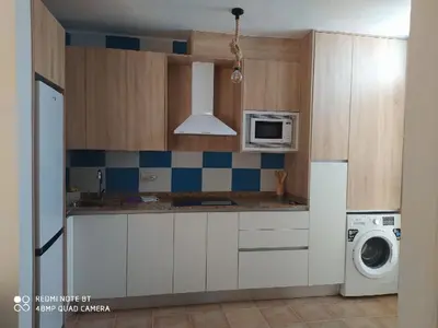 Una cocina o zona de cocina en La Casa de las Tejas Verdes