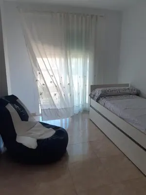 Cama o camas de una habitación en Amplio piso con vistas a la playa de Poniente