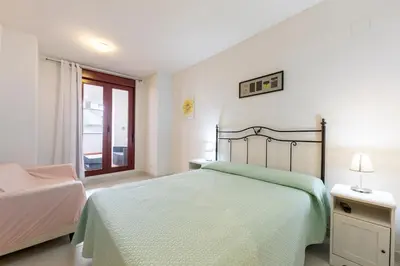 Cama o camas de una habitación en Apartamento increible, Playazo de Vera, 3 habitaciones, segunda línea de Playa