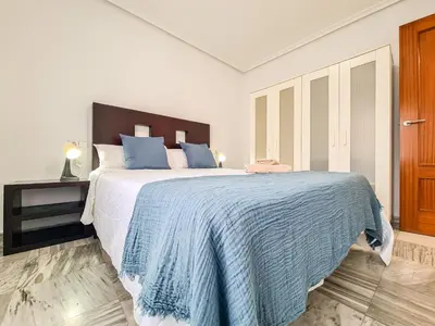 Cama o camas de una habitación en Avenida Guillermo Reina 1ºB