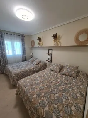 Cama o camas de una habitación en Ap-to Frente al Mar VillaRomana