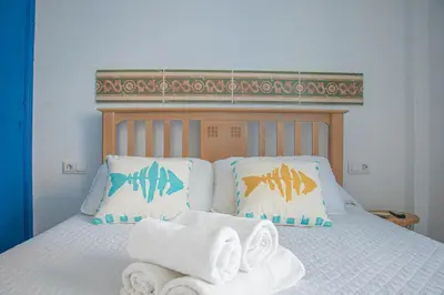 Cama o camas de una habitación en La Esperanza Beach- Zona Pubs y Restaurantes