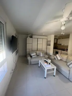 Una televisión o centro de entretenimiento en ESTUDIO PLAYA LA BAJADILLA Roquetas de mar