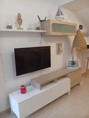 Una televisión o centro de entretenimiento en Casa Calypso San Juan de los Terreros