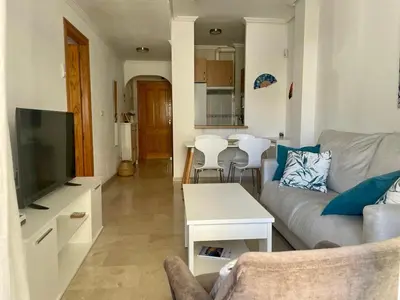 Una televisión o centro de entretenimiento en Apartamento Vive Garrucha