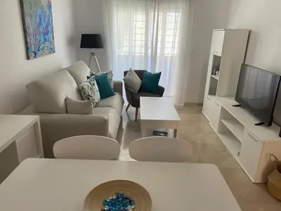 Una televisión o centro de entretenimiento en Apartamento Vive Garrucha