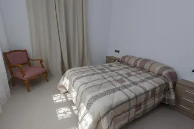 Cama o camas de una habitación en apartamentos El-Hizan