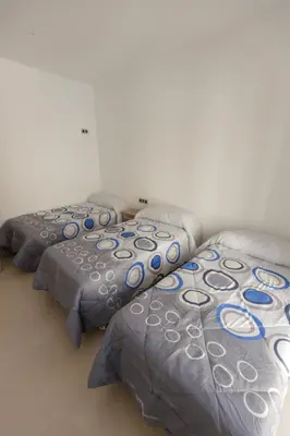 Cama o camas de una habitación en apartamentos El-Hizan