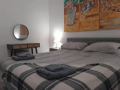 Cama o camas de una habitación en The Beach Hut with Lazy spa