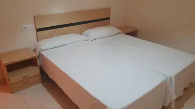 Cama o camas de una habitación en Apartamento Costa Rey VERARENTAL.COM a 100 metros de la playa