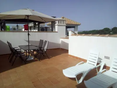 Un balcón o terraza de Ático junto al Mar,Acceso directo a la playa,Jardines de Nuevo Vera,WIFI