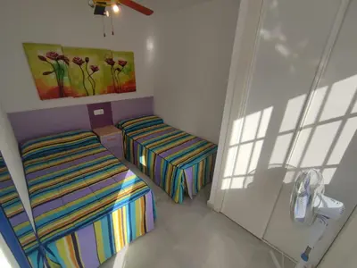 Cama o camas de una habitación en Ático en Balcones de Roquetas II