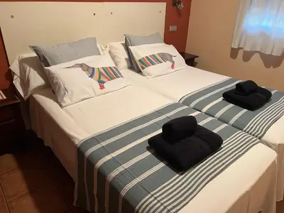 Cama o camas de una habitación en HOSTAL TREVELEZ