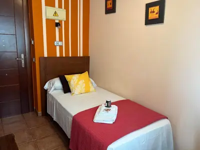 Cama o camas de una habitación en HOSTAL TREVELEZ