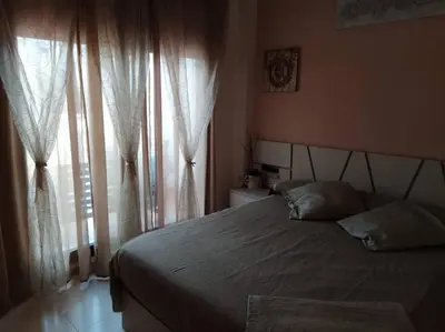 Cama o camas de una habitación en Bajo puerta de Alcazaba
