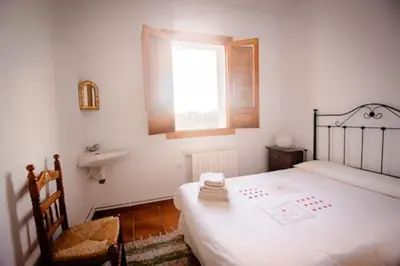 Cama o camas de una habitación en Casa Rural El Olivo. Alpujarra.