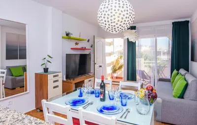 Una televisión o centro de entretenimiento en II Precioso apartamento con piscina y garaje II