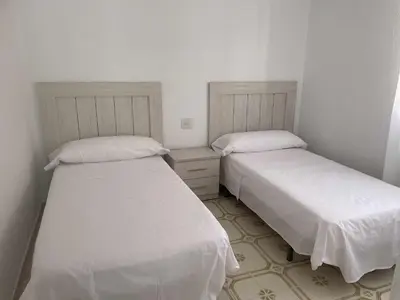 Cama o camas de una habitación en Calabardina Playa con Wifi y aire acondicionado