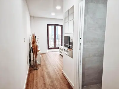 Una televisión o centro de entretenimiento en Apartamento TIENDAS 8