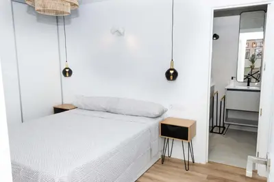 Cama o camas de una habitación en Ático Moderno Cañada Aguilar 10