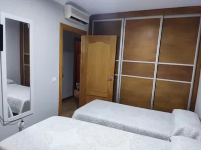 Cama o camas de una habitación en piso 3 habitaciones urbanizacion