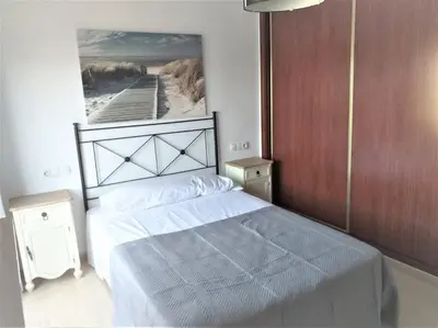 Cama o camas de una habitación en Aguadulce familiar y económico, Piscina Playa Wifi